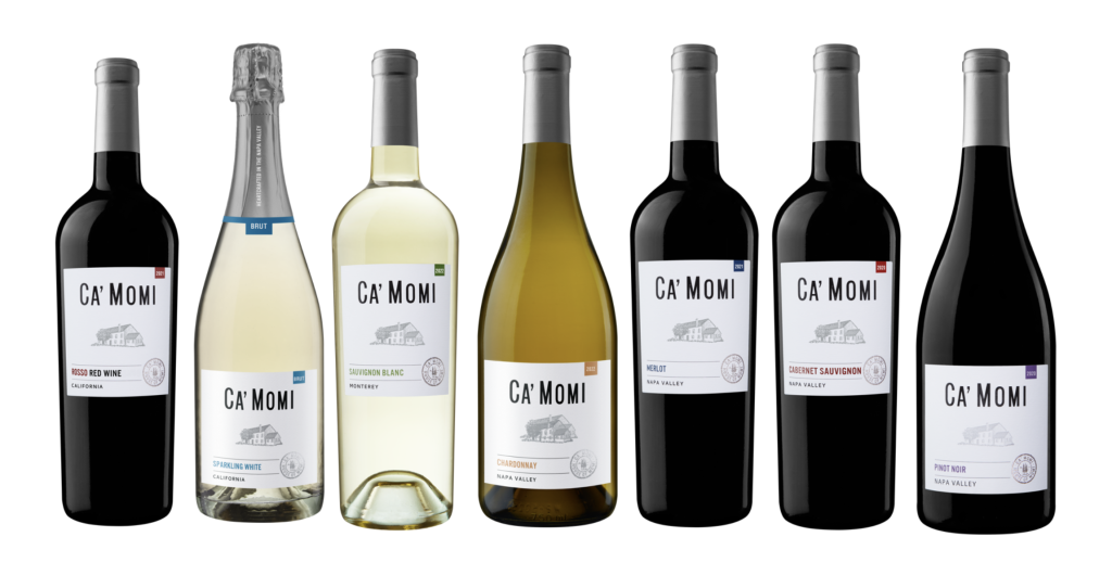 Seven different Ca' Momi bottles sit side by side against a white background, spanning a range of white and red wine varietals. 